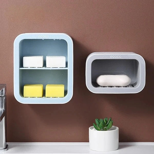 Keep your soaps neatly organized with this double-layer wall-mounted soap holder. Designed to save space and provide easy access to your bathroom essentials.