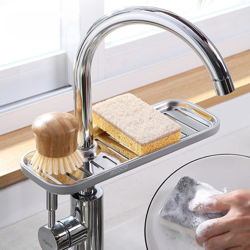 Multipurpose sink organizer designed to mount on your faucet. Ideal for holding sponges, scrubbers, or dish soap while allowing excess water to drain away.

