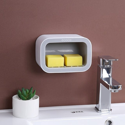 Stylish double shelf set for wall mounting, with a blue and pink design for organizing soaps, sponges, or personal items.

