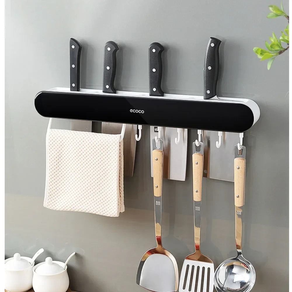 Set of Ecoco organizers in black and white with magnetic strips and hooks, designed to optimize kitchen storage space.

