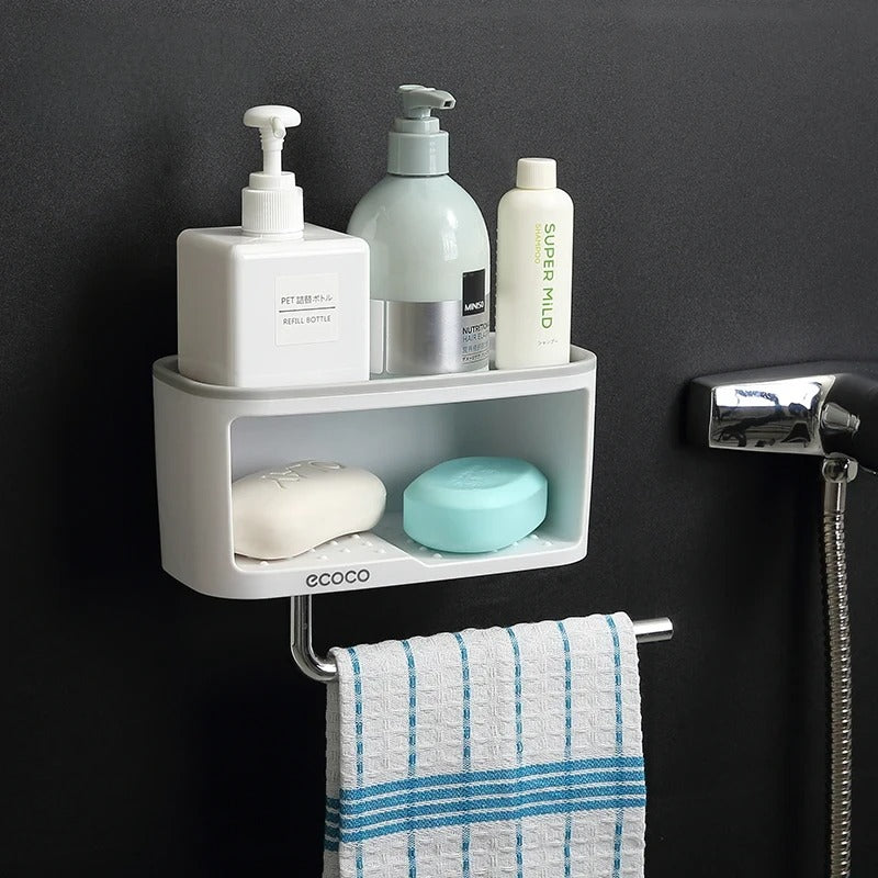 Wall-mounted Ecoco shelf in blue, suitable for storing sponges, soap, and kitchen essentials, with a towel hook for added convenience.

