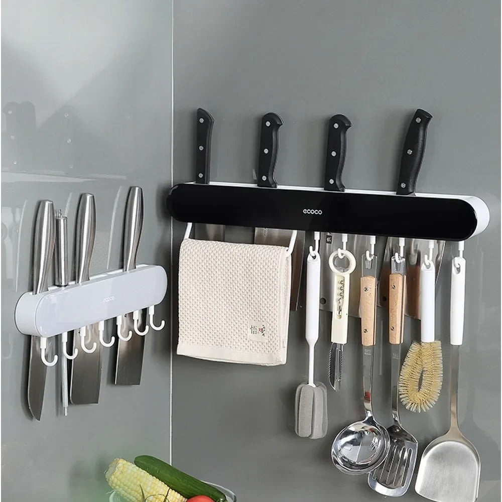 Sleek Ecoco wall-mounted knife holder with a magnetic strip and hooks, perfect for organizing kitchen tools and knives.

