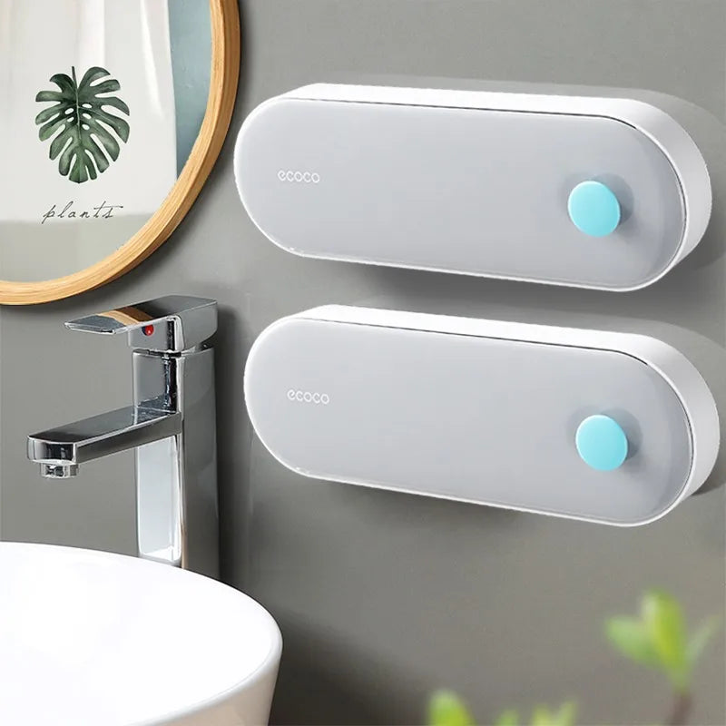 Modern black and gray Ecoco wall-mounted soap holder with dual storage sections and drainage, keeping soap fresh and dry.

