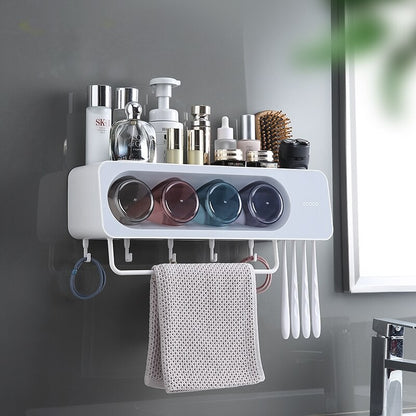 Wall-mounted multi-functional kitchen storage rack with four integrated cups, a top shelf for toiletries or kitchen essentials, hanging hooks for towels and accessories, and a sleek modern design.