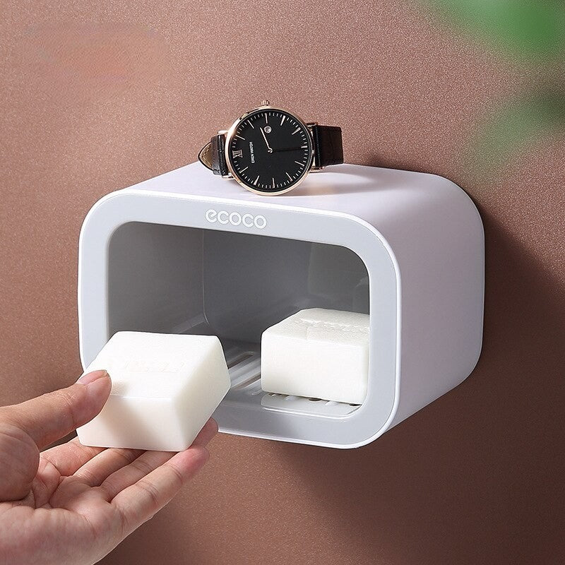 Versatile white wall-mounted organizer with a soap tray and top surface, ideal for soaps, watches, or small accessories.

