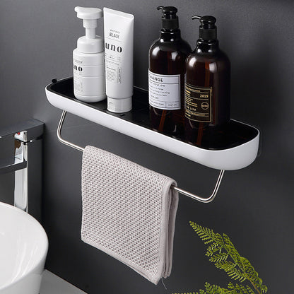 Sleek single-tier shelf with a towel rack, ideal for organizing shampoo bottles, lotions, and other bathroom essentials.

