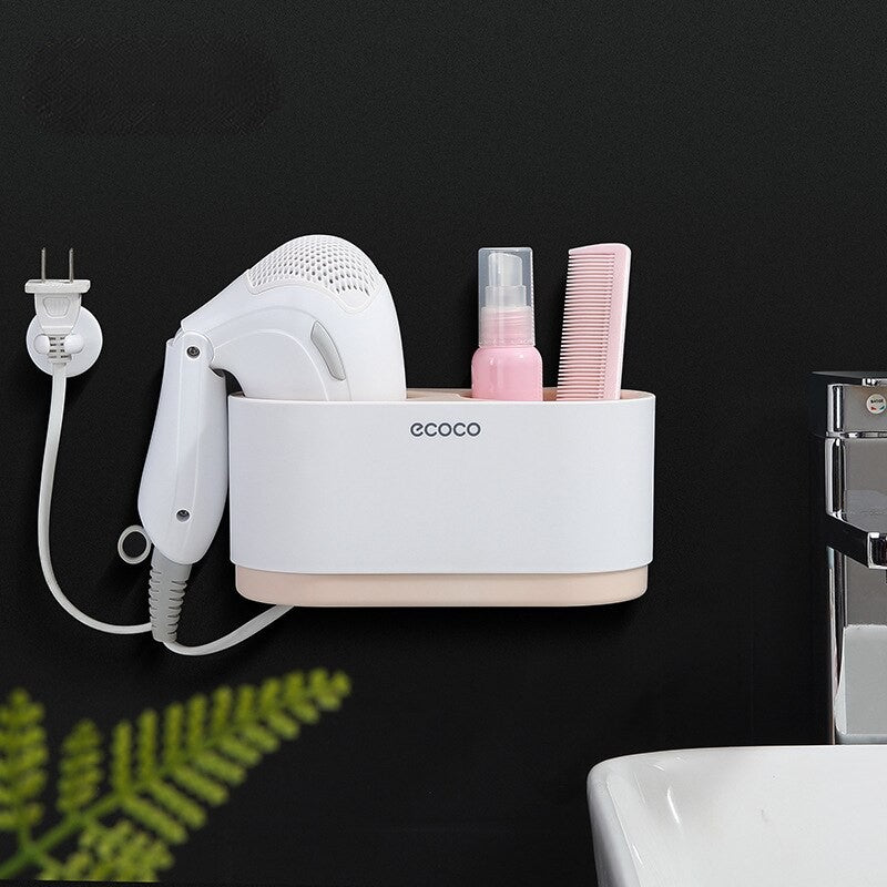 Space-saving white Ecoco storage rack with sections for a hairdryer, shampoo, and beauty tools, enhancing bathroom organization.