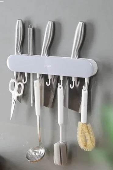 Minimalist Ecoco wall-mounted magnetic rack with hooks for knives and utensils, perfect for decluttering and organizing kitchen spaces.







