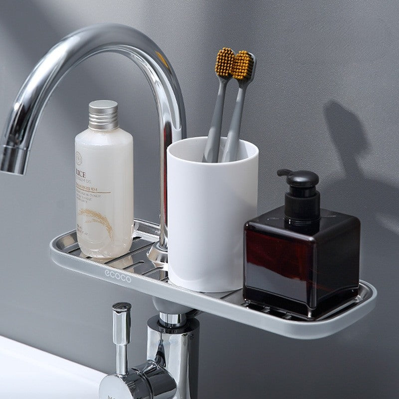 A durable, rust-proof stainless steel rack that mounts onto the faucet. Ideal for holding sponges, scrubbers, or dish soap, keeping your sink area neat and organized.

