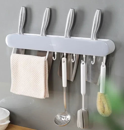 Elegant Ecoco magnetic holder in white, featuring hooks for utensils and a sleek design for knife storage.

