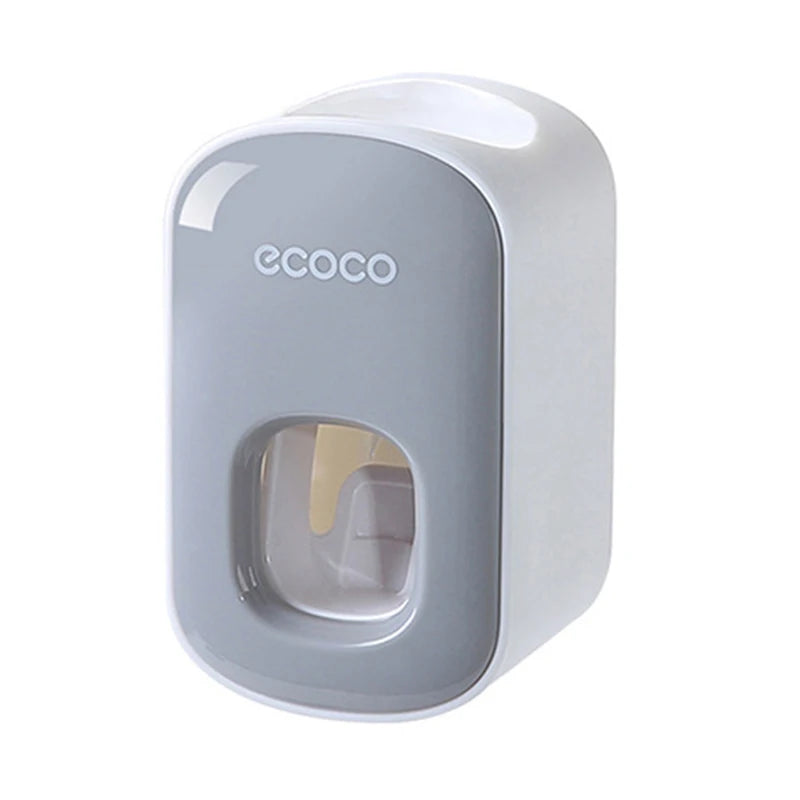 Ecoco toothpaste dispensers in black and gray, with a toothbrush ready for easy toothpaste dispensing.