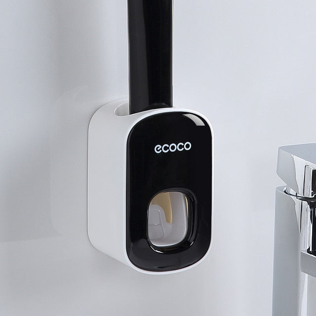 Black and gray Ecoco toothpaste dispensers with built-in UV light for toothbrush sterilization and hygiene enhancement.