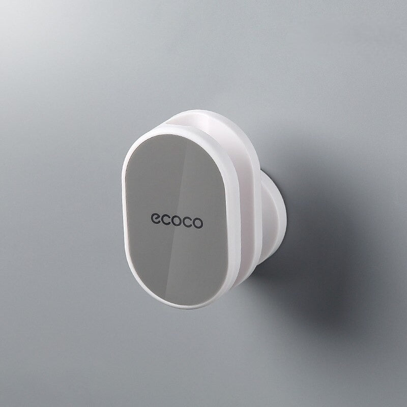 Sleek black Ecoco shower head holder with a minimalist, adhesive wall-mounted design for a modern bathroom setup.

