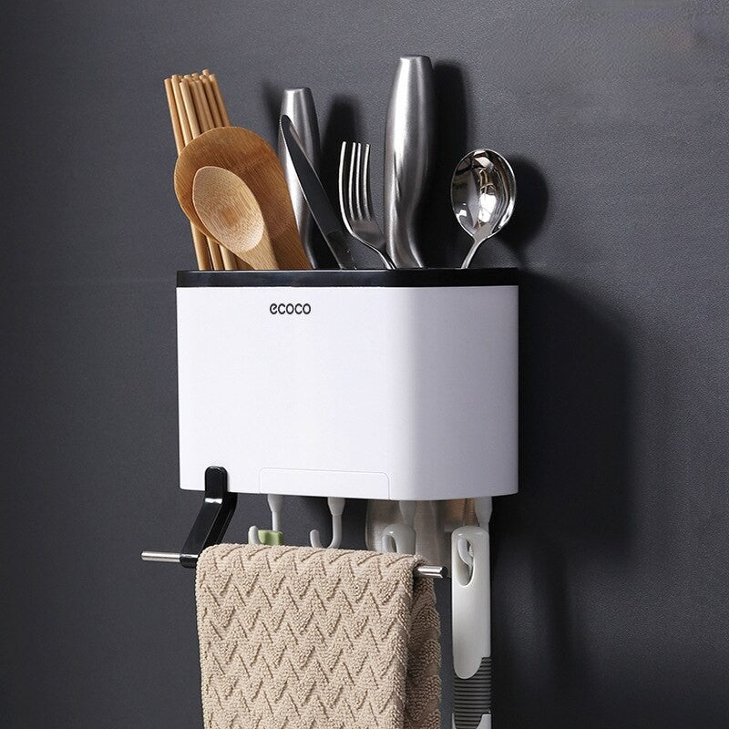 Modern Ecoco wall-mounted kitchen organizer with multiple compartments for cutlery, hooks for towels, and a sleek black-and-white design.