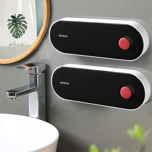 Sleek black Ecoco wall-mounted soap dispenser with a modern design and red button, perfect for stylish bathroom organization.