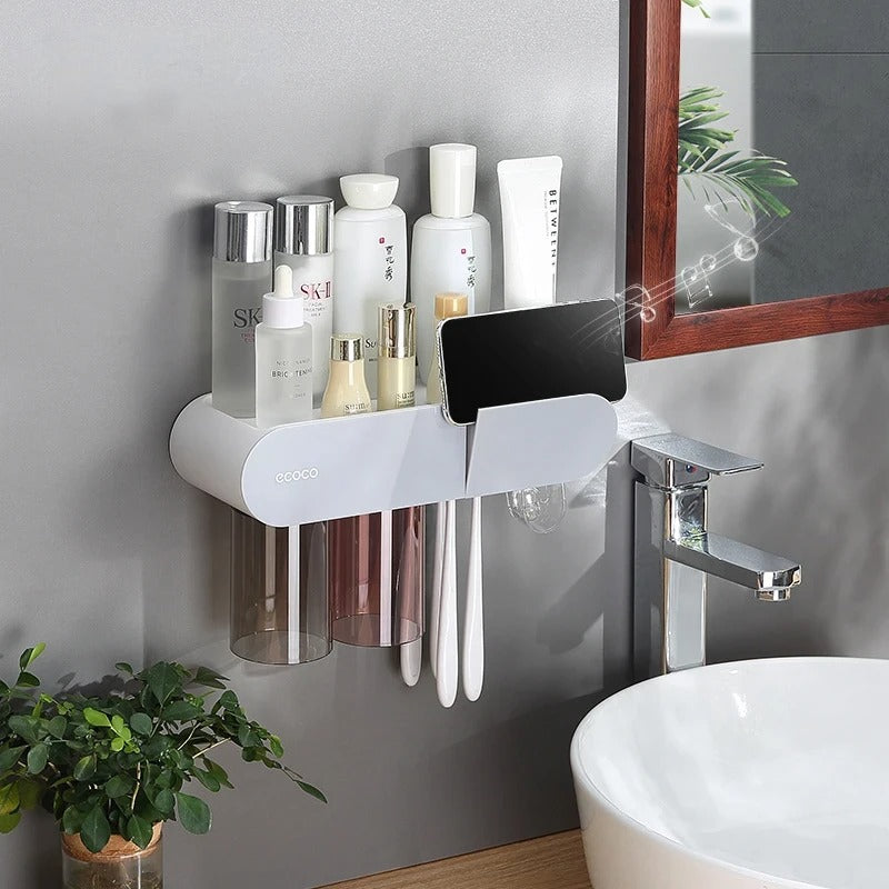 Wall-mounted storage system with sleek black and white design, featuring magnetic cups and toothbrush holders.