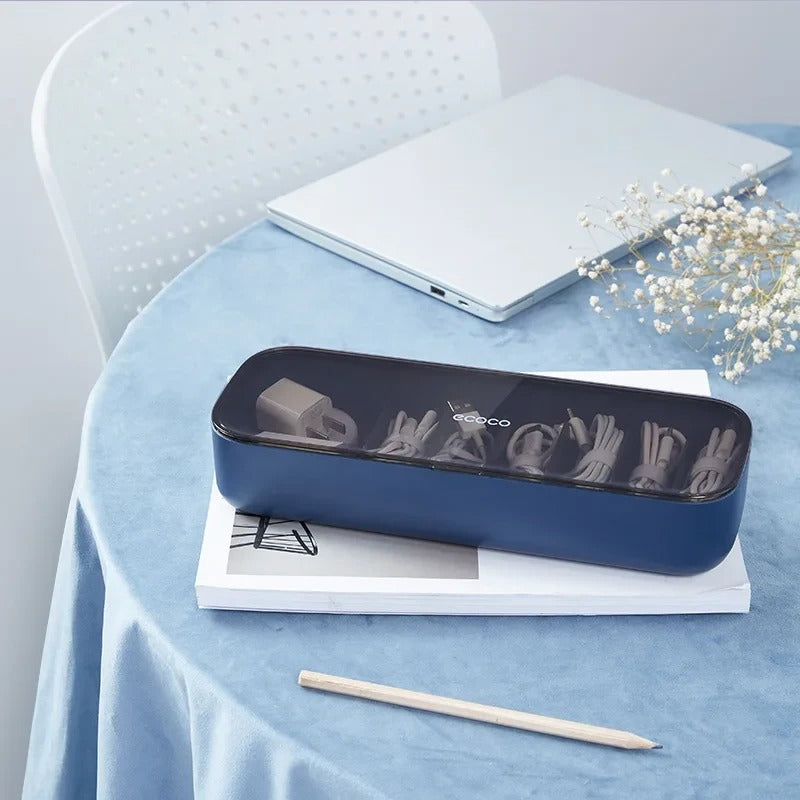 Blue cable storage box with a transparent lid, designed for keeping phone chargers, cables, and power adapters organized.