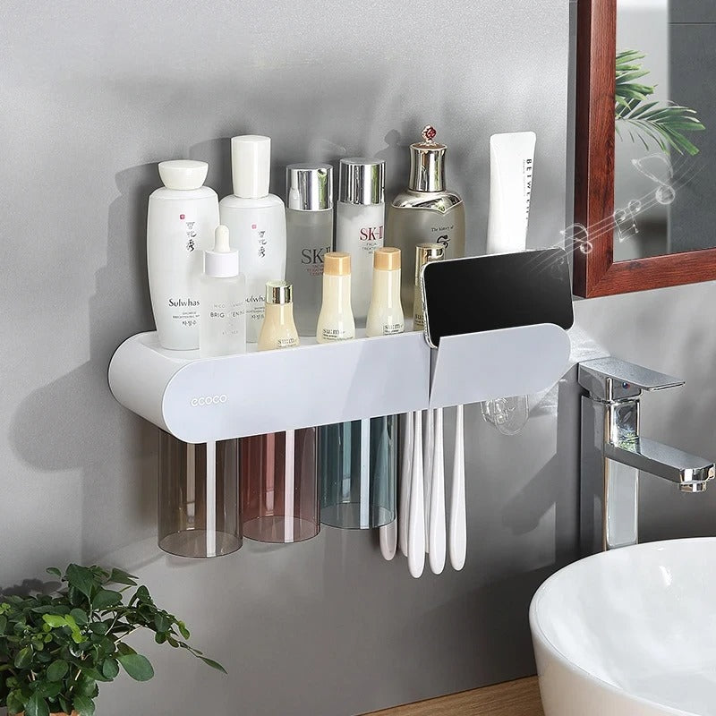 Sleek white and black bathroom shelf with storage for toiletries, toothbrushes, and magnetic drying cups.