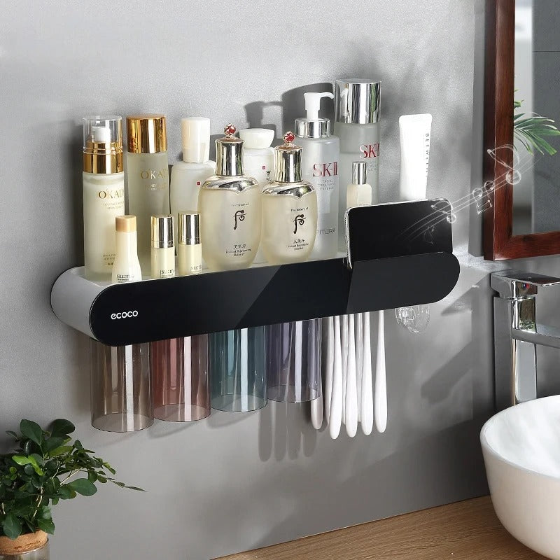 White wall-mounted bathroom storage rack with cup dispensers, toothbrush slots, and space for skincare products.