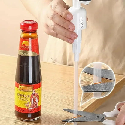 A hands-free smart dispenser for soy sauce, vinegar, or other condiments. Features a modern, compact design for precise one-touch dispensing.

