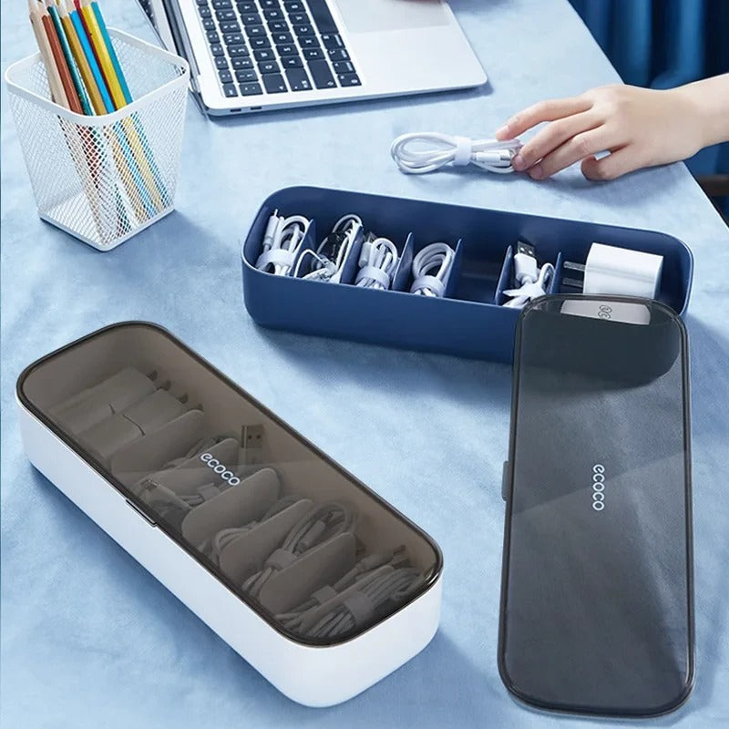 Blue cable management box with a tinted lid, ideal for storing and organizing chargers, cables, and adapters neatly.