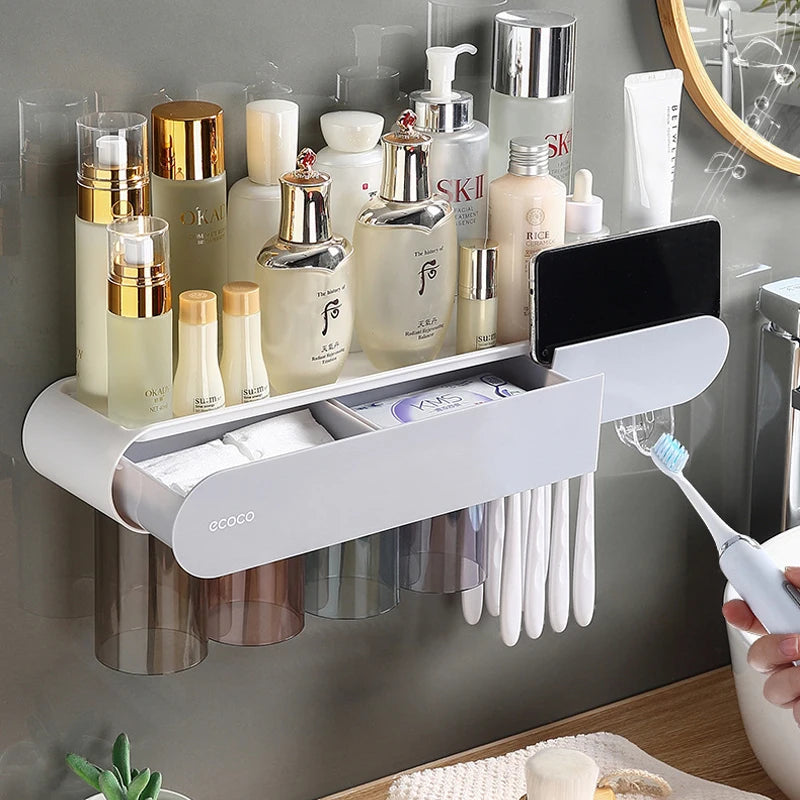 Modern wall-mounted storage rack with cup holders, toothbrush slots, and a phone stand for organized bathroom essentials.