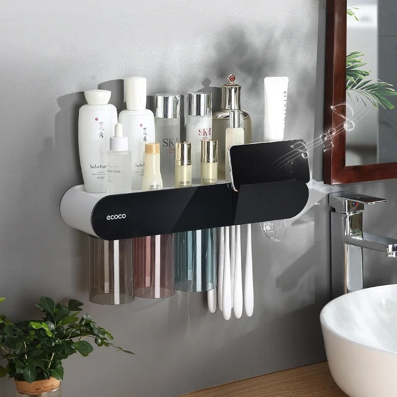 Wall-mounted magnetic cup holder with auto-drying feature, ideal for bathroom or kitchen use.