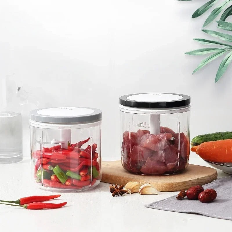 Transparent food chopper with different size options, designed for grinding meat, mincing garlic, and chopping ingredients efficiently.

