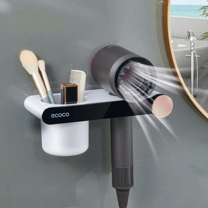 Compact wall-mounted hair dryer stand with a sleek design, featuring a magnetic holder and extra storage for beauty essentials.